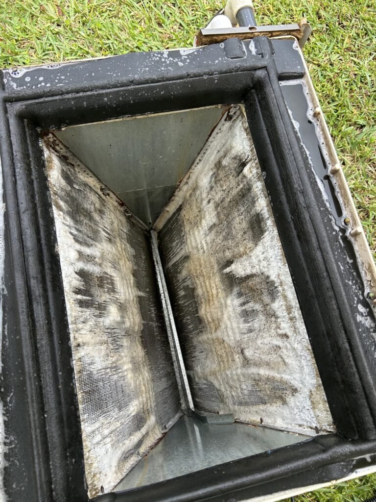 Dirty evaporator coil removed from an HVAC system before a deep cleaning in Miami-Dade County