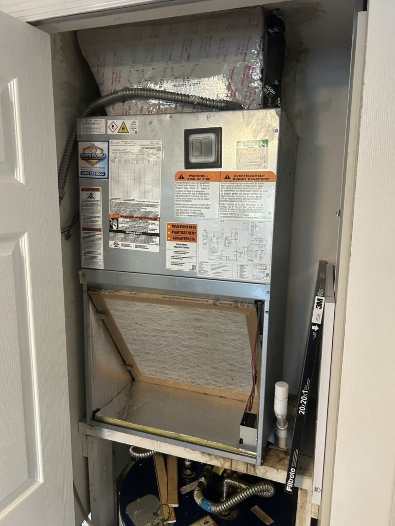 New Rheem air handler with return filter box installed in a residential HVAC closet in South Florida